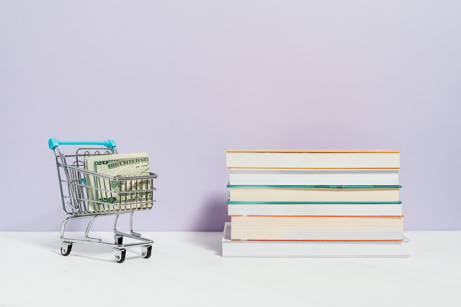 Stack of hardcover finance books resting on a library table