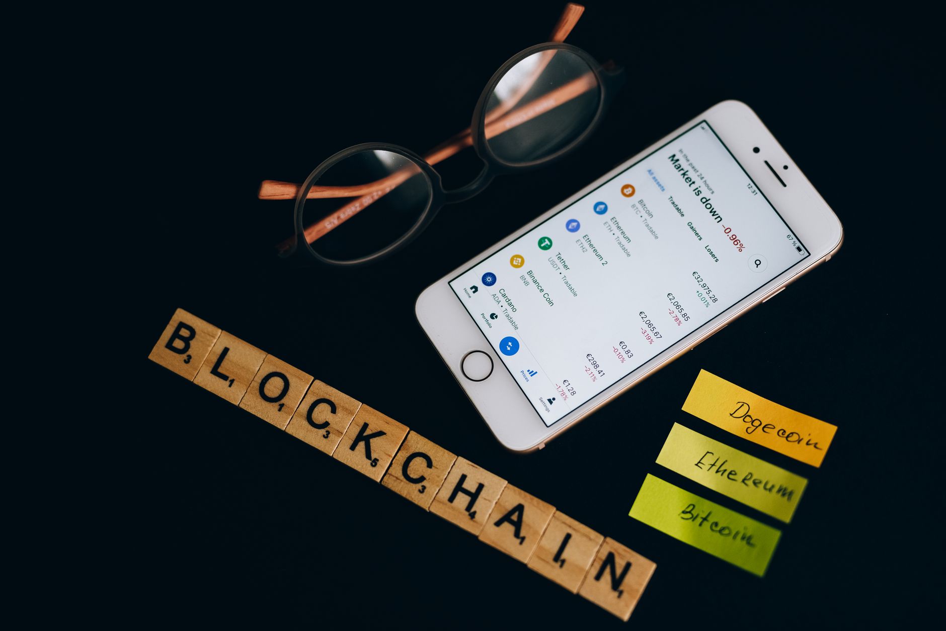 Person holding smartphone showing staking dashboard for cryptocurrency
