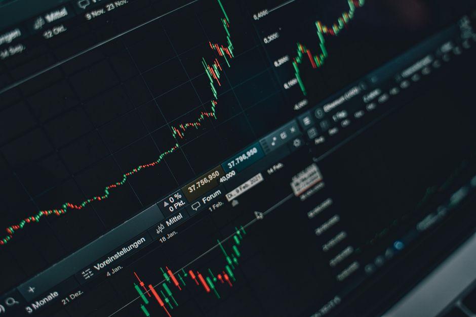 Laptop showing crypto price analysis with target levels marked