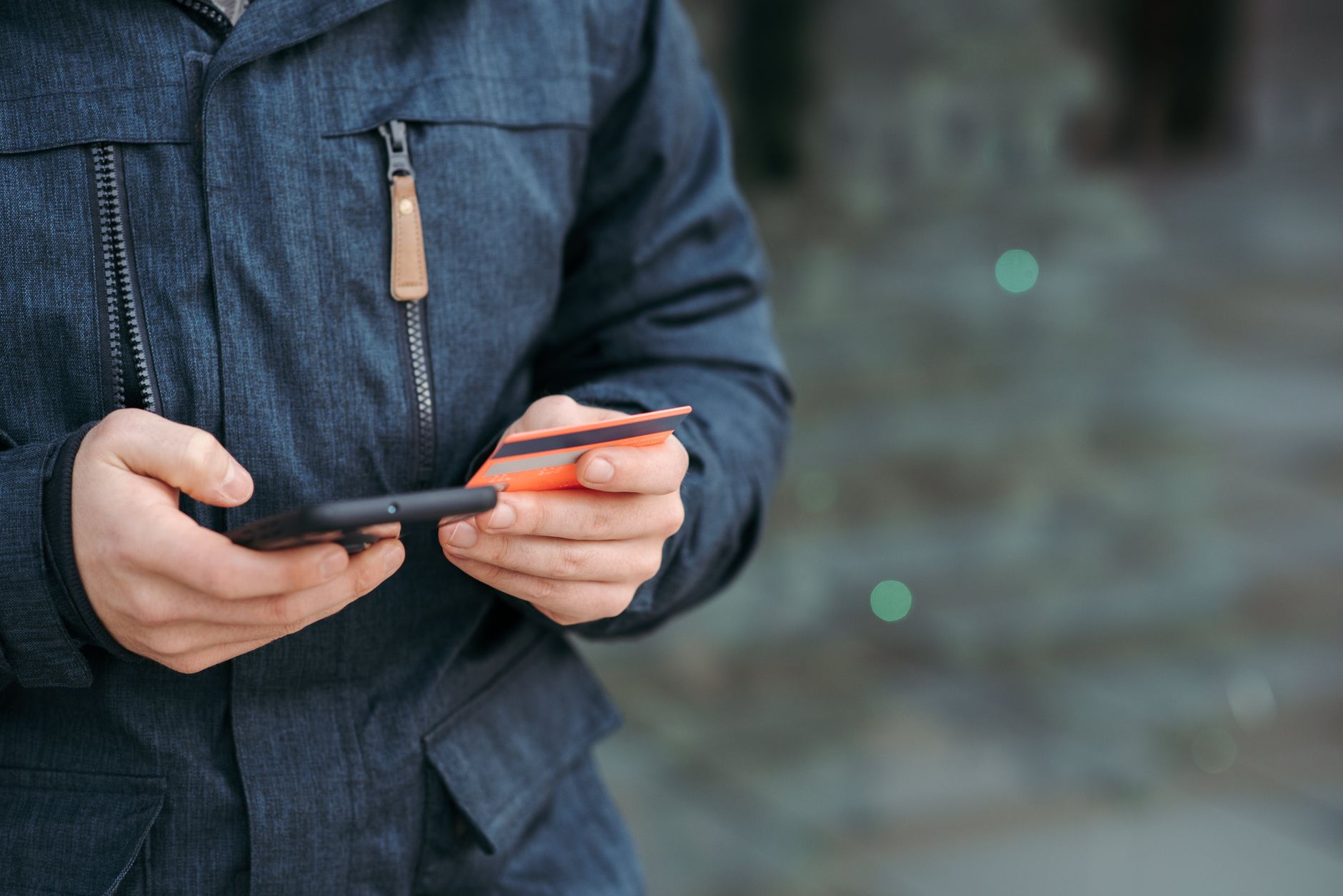 Person sending an e-Transfer from a smartphone to fund a bitcoin account