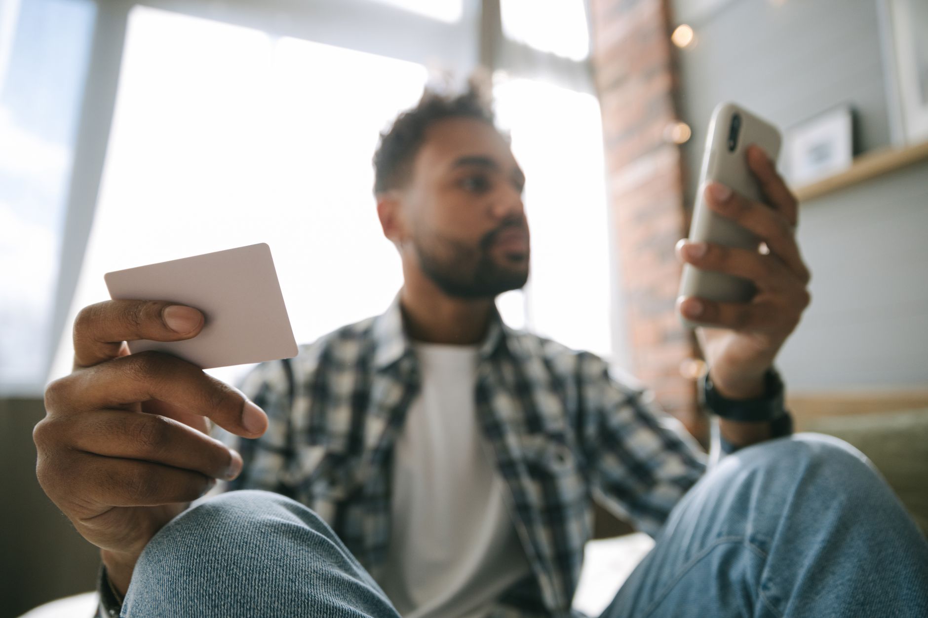 Person using a smartphone for an online bank transfer
