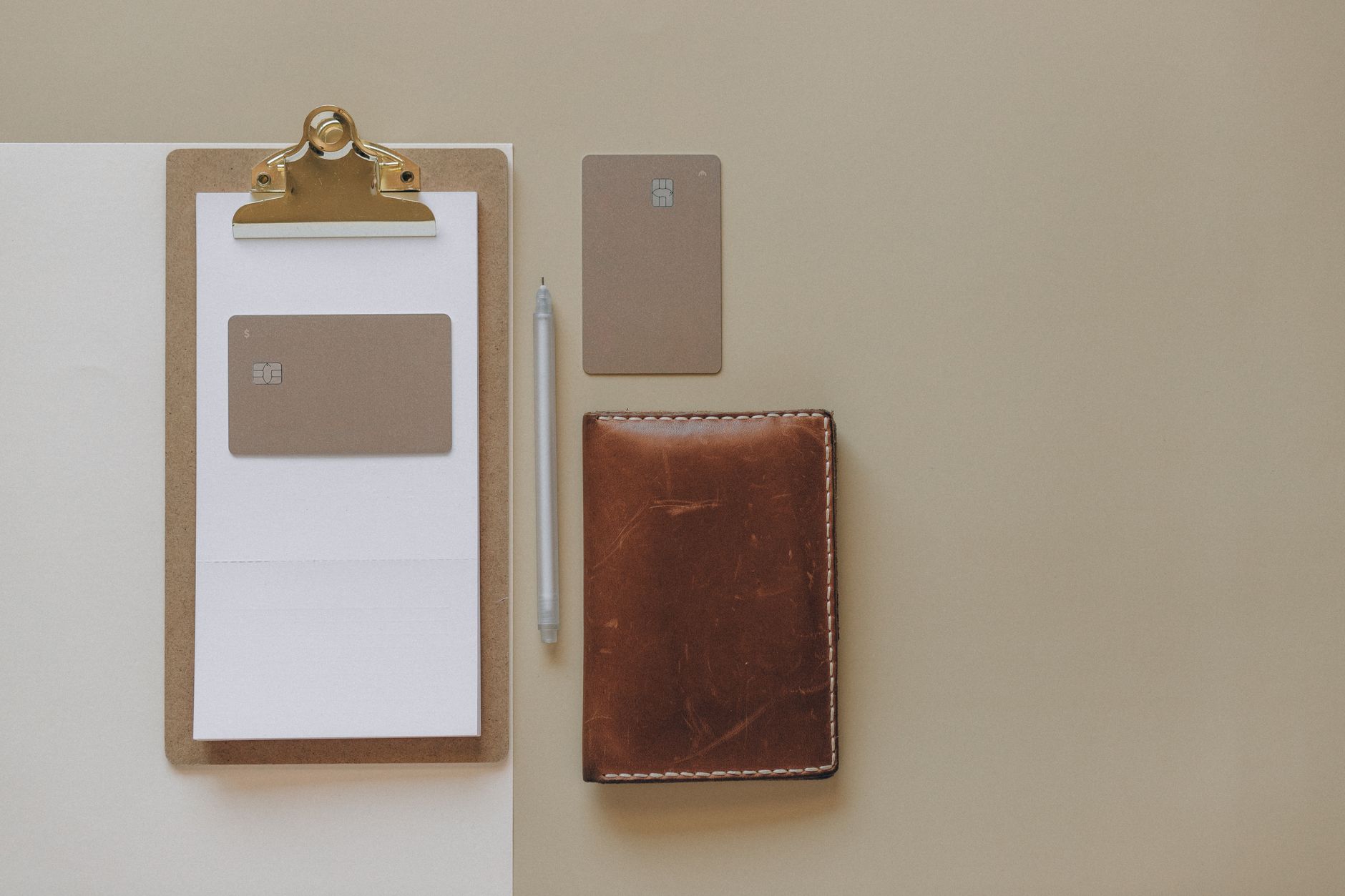 Hardware cryptocurrency wallet next to a paper with a seed phrase
